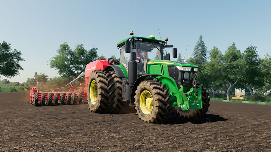 A modified John Deere 7R is planting seeds, using a Horsch seeder