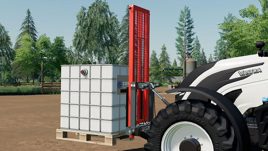 The attachable forklift, attached to the front of a Valtra tractor