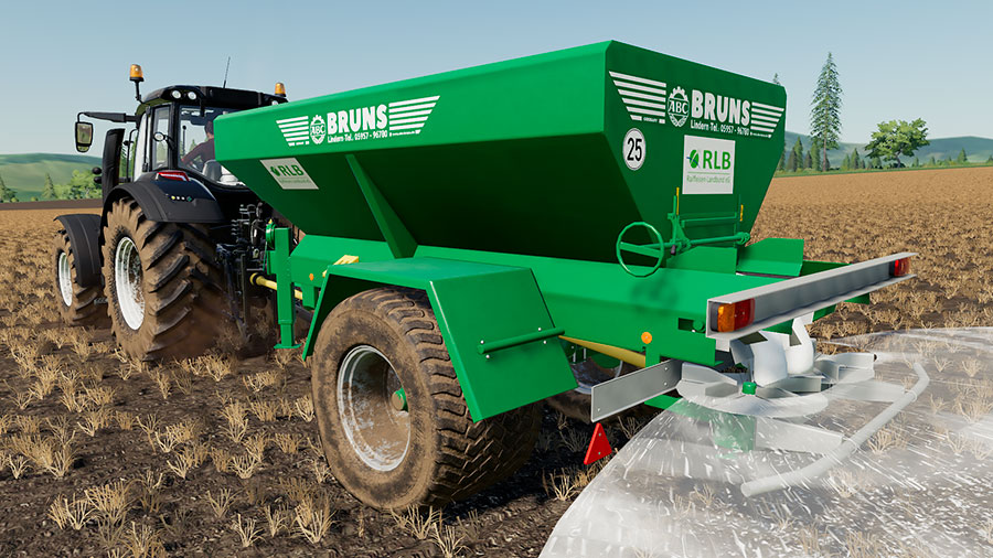 A close up of the Bruns trailer spreading lime in a field