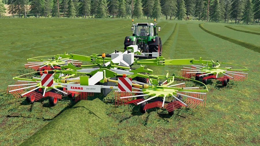 The Claas Liner 4000 windrower creating swaths in a field, pulled by a Fendt tractor