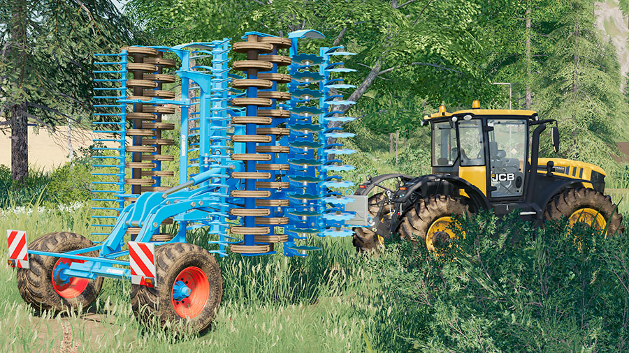 The Lemken Heliodor 9/600 in transport mode (folded) pulled by a JCB tractor