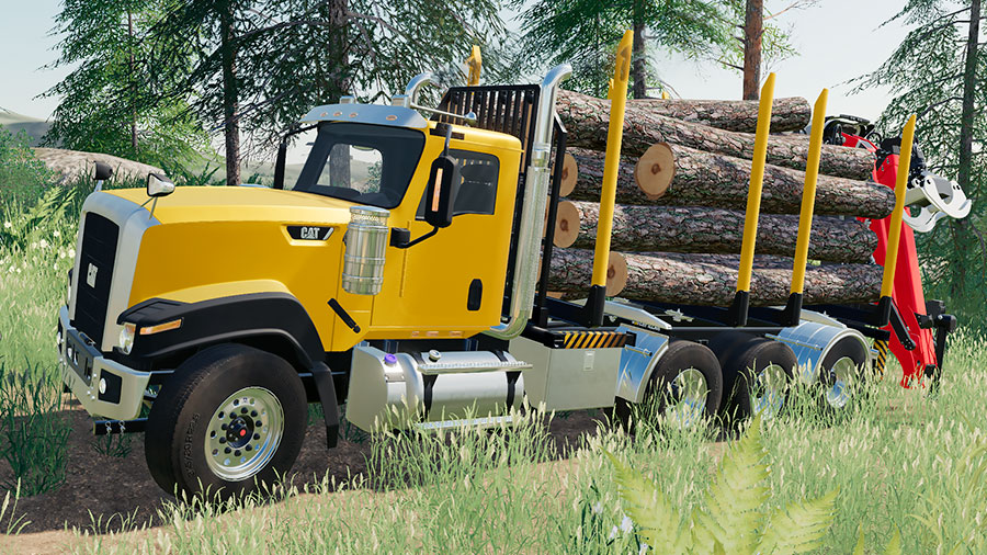 A Cat CT680 truck transporting logs on a swap body log bed