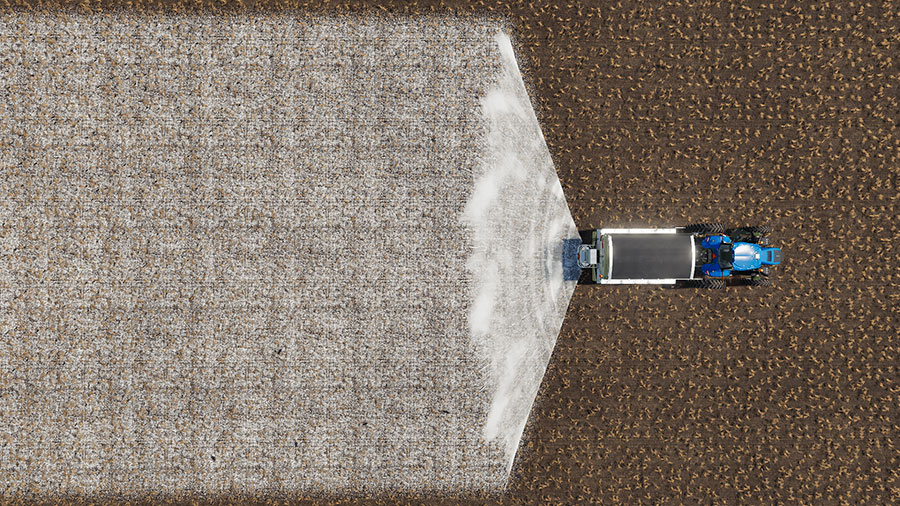 Demonstrating the working width of the New Leader NL345G4 tow-behind spreader