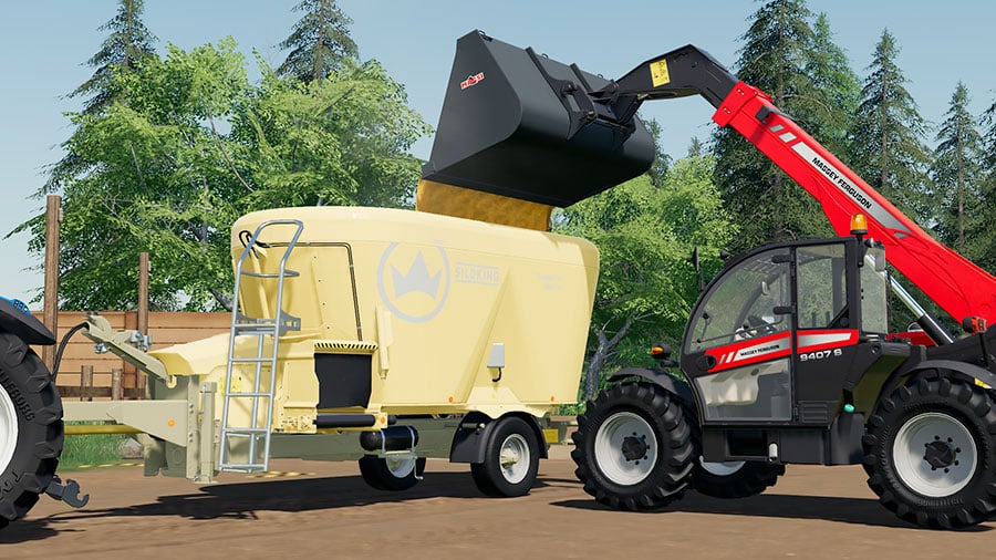 Telehandler tipping corn into the SiloKing feed mixer