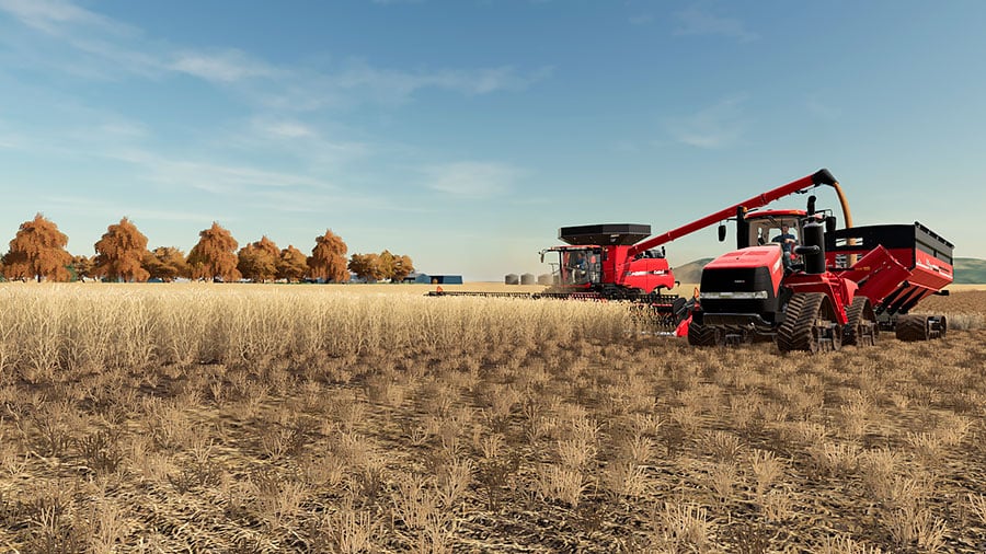 A Case IH combine and a Case IH tractor during harvest